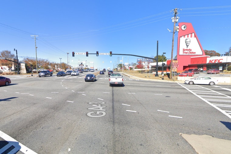 Marietta Police Officers Injured Following Collision with Mustang Near Big Chicken Landmark