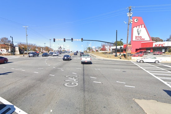 Marietta Police Officers Injured Following Collision with Mustang Near Big Chicken Landmark
