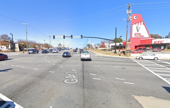 Marietta Police Officers Injured Following Collision with Mustang Near Big Chicken Landmark