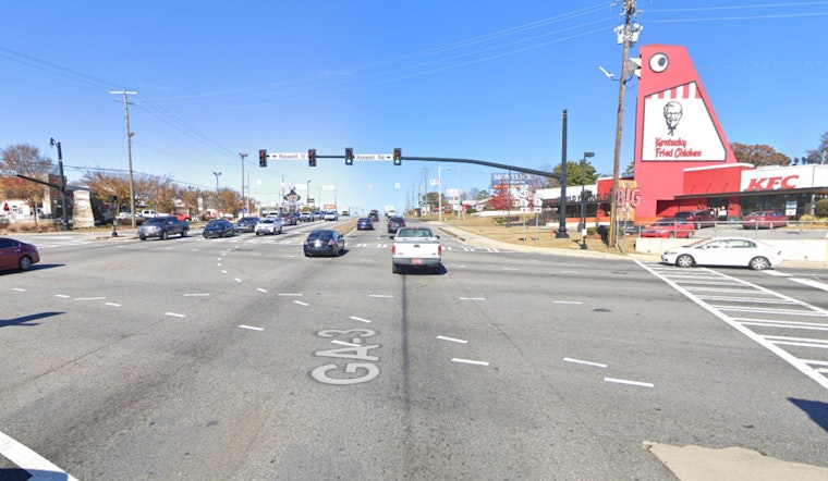 Marietta Police Officers Injured Following Collision with Mustang Near Big Chicken Landmark