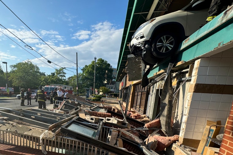 SUV Dangles Over Edge After Crashing Through Whole Foods Garage Wall in Northwest D.C.