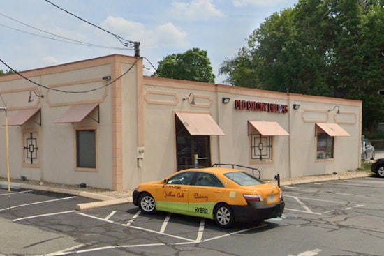 Adult and Juvenile Hospitalized After Car Smashes Into Quincy Liquor Store, Prompting Investigation
