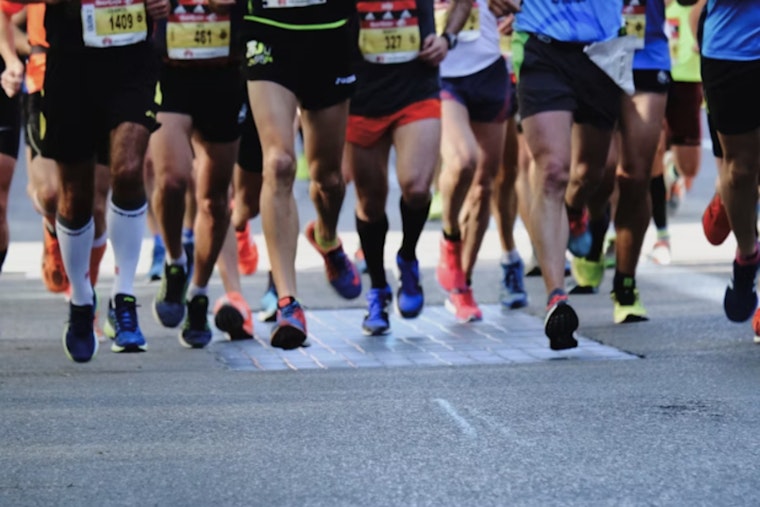 Andrew Bowman, Christina Welsh Win Rain-Soaked Detroit Free Press Marathon