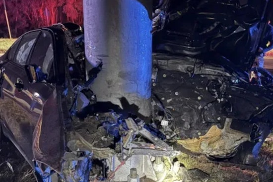 Driver Seriously Injured as Car Crashes into Pole and Catches Fire in Woburn, Massachusetts