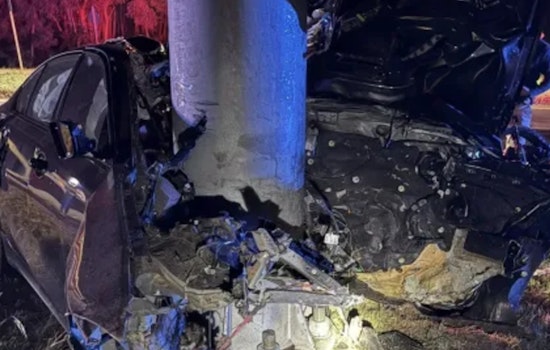 Driver Seriously Injured as Car Crashes into Pole and Catches Fire in Woburn, Massachusetts