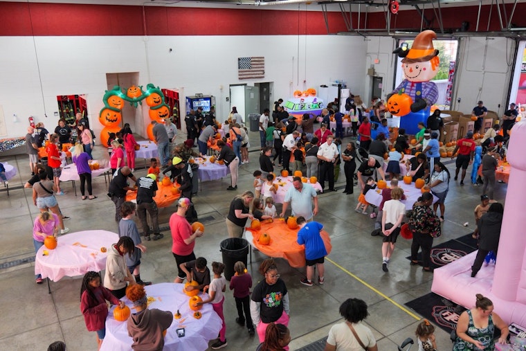 Ferguson Community Unites for Festive Pumpkin Carving with Local Fire Department