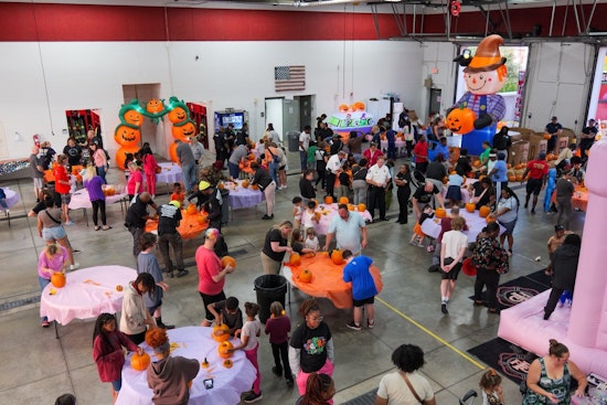 Ferguson Community Unites for Festive Pumpkin Carving with Local Fire Department