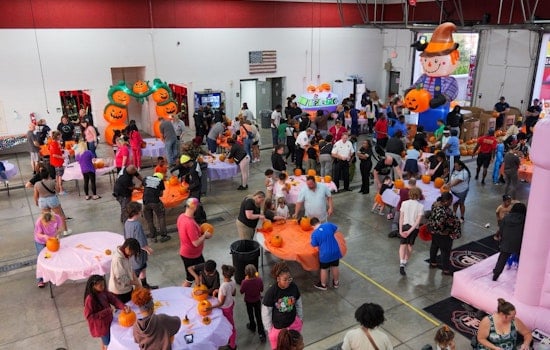 Ferguson Community Unites for Festive Pumpkin Carving with Local Fire Department