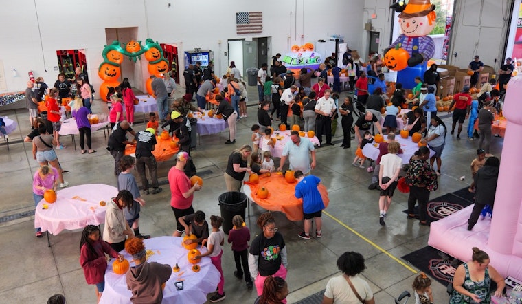 Ferguson Community Unites for Festive Pumpkin Carving with Local Fire Department