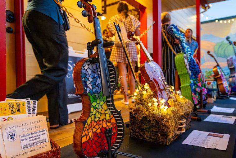 Issaquah's "Strings of Change" Exhibit Transforms Water-Damaged Instruments into Art, Extends Run at Historic Shell Station