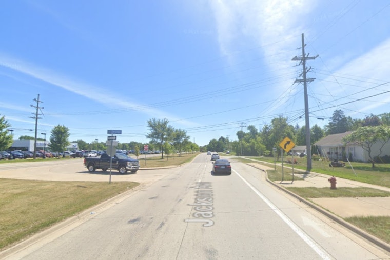 Michigan State Trooper Sustains Minor Injuries in Collision with Car Hauler in Ann Arbor