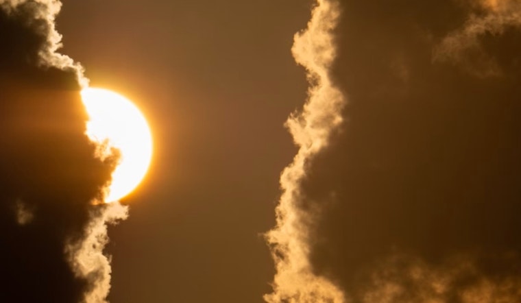 Mixed Weather in Boston Brings Sunny Days and Showers with Tropical Systems Monitored