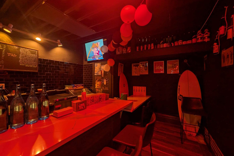 Interior seating area with red ambient lighting
