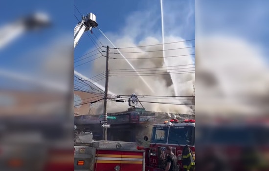 Bronx Blaze at Auto Shop Injures Firefighters, Displaces Families, and Sparks Investigation
