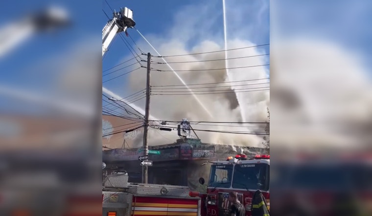 Bronx Blaze at Auto Shop Injures Firefighters, Displaces Families, and Sparks Investigation