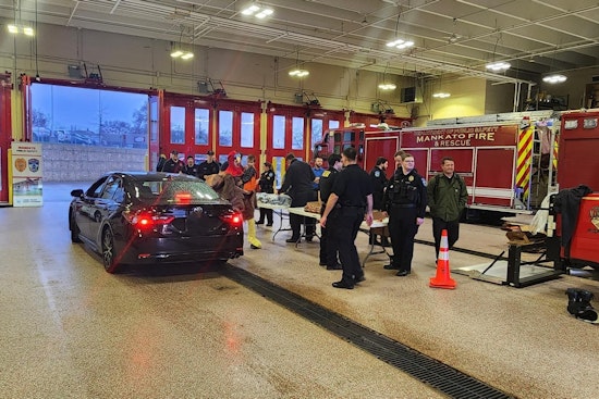 Mankato Police, Fire Departments, and Local Partners Distribute Holiday Meal Kits to 100 Families in Need