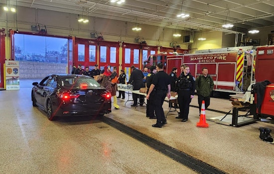 Mankato Police, Fire Departments, and Local Partners Distribute Holiday Meal Kits to 100 Families in Need