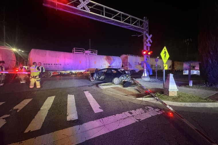 No Injuries Reported as Train Clips Car Near Marietta Square, Disrupting Traffic on Waverly Way