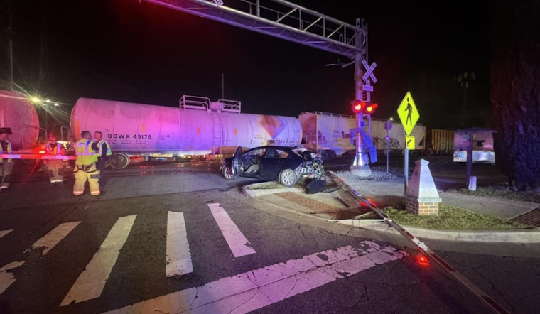 No Injuries Reported as Train Clips Car Near Marietta Square, Disrupting Traffic on Waverly Way