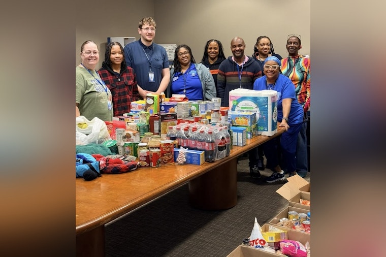 St. Louis Police Dept's Telephone Reporting Unit Garners Praise for Holiday Food Donation to Local School
