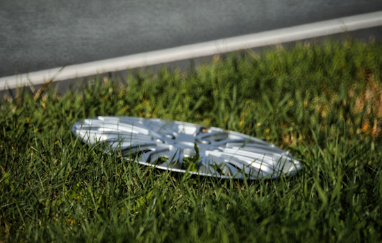 Baltimore Cyclist Creates Urban Art Gallery with Over 700 Upcycled Hubcaps