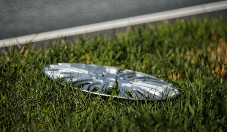 Baltimore Cyclist Creates Urban Art Gallery with Over 700 Upcycled Hubcaps
