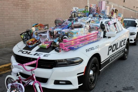 Join Statesville Police Department's Fill the Trailer Toy Drive at Walmart on December 6
