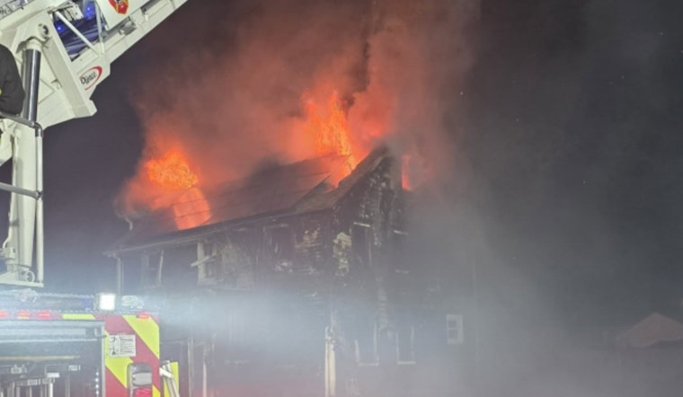 Resident and Firefighter Injured as Fire Rages Through New Bedford Home, Investigation Underway