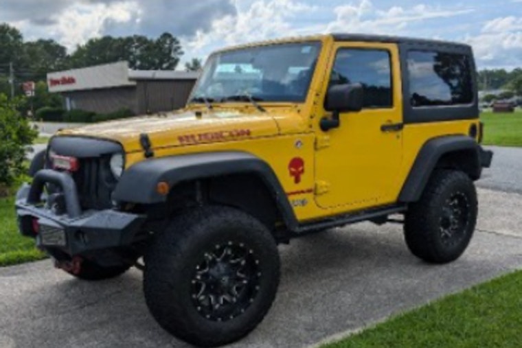 Statesville Police Seek Community Help in Locating Stolen Yellow Jeep Wrangler