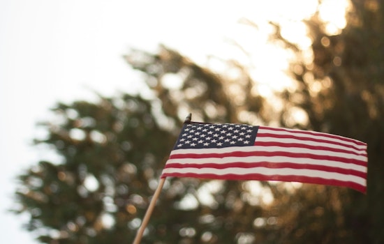Tears, Pride and Tiny Flags as 91 New Americans Take Oath at South Side Museum