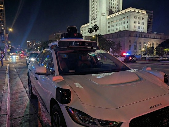 VIDEO: Waymo Robotaxi Casually Rolls through Active LAPD Standoff as Officers Confront Armed Suspect