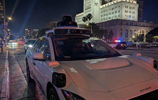 VIDEO: Waymo Robotaxi Casually Rolls through Active LAPD Standoff as Officers Confront Armed Suspect