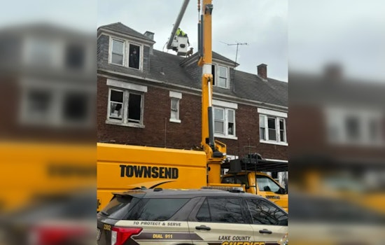 Gary Community Bands Together to Rescue Dog Stranded on Rooftop; Safe Thanks to Local Officers and Tree Company