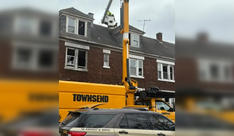 Gary Community Bands Together to Rescue Dog Stranded on Rooftop; Safe Thanks to Local Officers and Tree Company