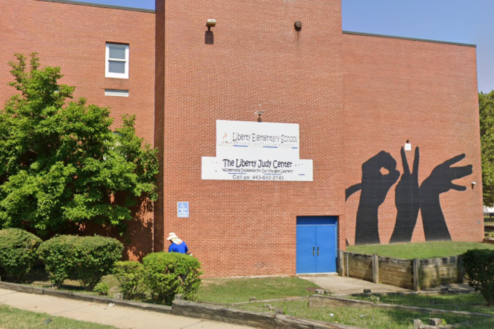Baltimore Teacher with Gun Conviction Accused of Shooting Police Officer: School's Hiring Decisions Under Fire