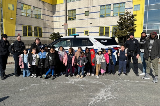 Boston Police Officers Engage with Students at Orchard Gardens School Career Day to Foster Community Trust
