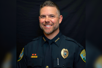 Chris Kirk Confirmed as Permanent Police Chief of New Smyrna Beach Amidst Applause and Unanswered Salary Queries