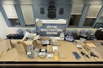 Milwaukee Police Seize Large Drug Cache and Firearms, Arrest Probation Violator in Major Operation