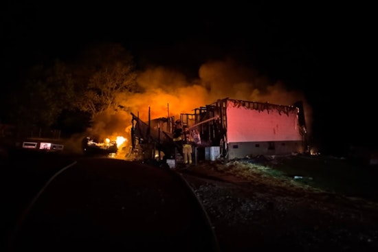 South Knox County Family Escapes Unharmed as Home Erupts in Flames Amidst Explosions from Stored Ammunition