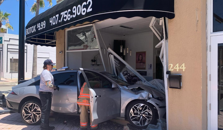 Two Injured as Car Crashes into Daytona Beach Business Following Red Light Collision