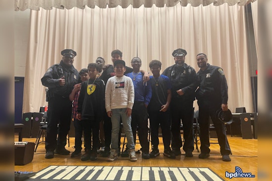 Boston Police Officers Join JFK Elementary's Rite of Passage, Celebrating Student Milestones and Community Bonds