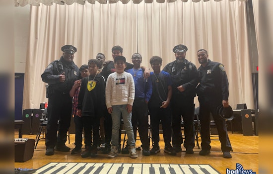 Boston Police Officers Join JFK Elementary's Rite of Passage, Celebrating Student Milestones and Community Bonds