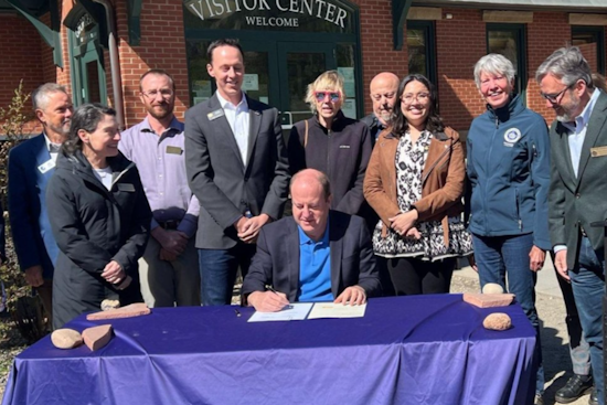 Colorado Governor Polis Signs Bipartisan Winter Road Safety Bill with Chain-Assist Program for Drivers in Vail and Beyond