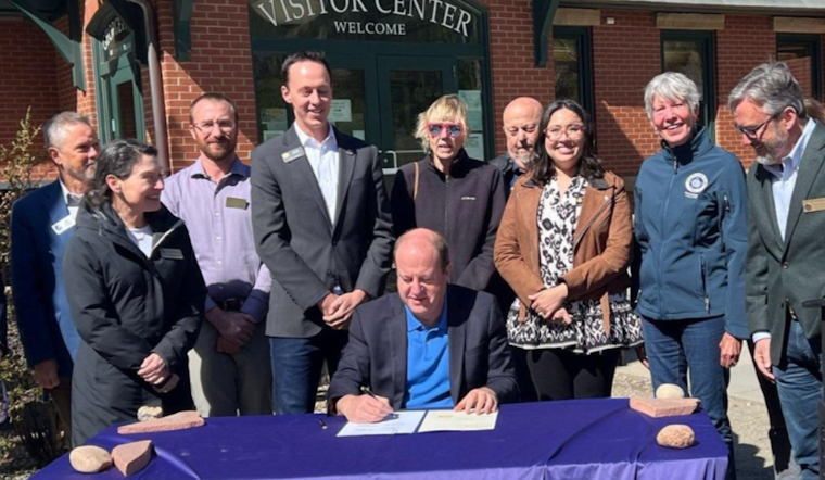 Colorado Governor Polis Signs Bipartisan Winter Road Safety Bill with Chain-Assist Program for Drivers in Vail and Beyond