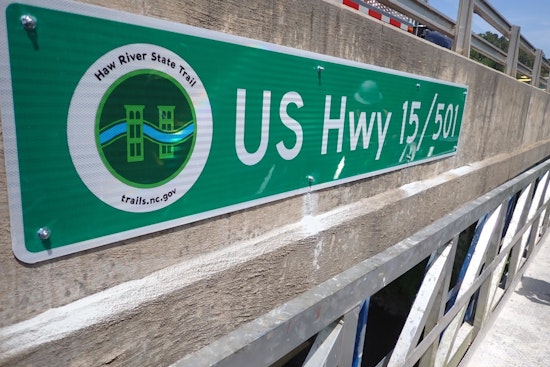 New Signage Over Haw River Bridges Aids Paddlers and Enhances Emergency Response