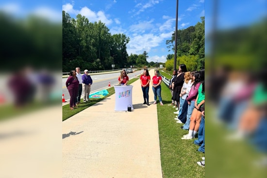 Duluth High School Students and Paint Love Transform Storm Drains into Environmental Art on George Rogers Avenue
