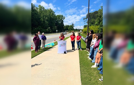 Duluth High School Students and Paint Love Transform Storm Drains into Environmental Art on George Rogers Avenue