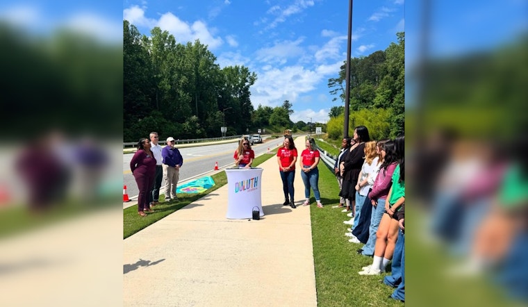 Duluth High School Students and Paint Love Transform Storm Drains into Environmental Art on George Rogers Avenue