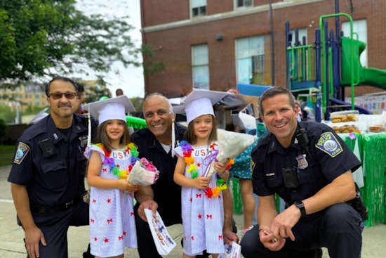 Boston Police Celebrate Preschool Graduates at Kennedy Center School in Charlestown with Safety Coloring Books