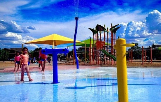 Las Cruces Police Partner with Raising Cane's for Community Engagement at Metro Verde Splash Pad